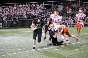 Caleb Gerken dodges a tackle Friday, October 7th against Southview. Photo credit: Chris Gulguin