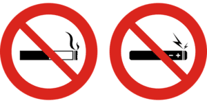 Two signs, one with a cigarette and one with an e-cigarette, both with a large red slash through them