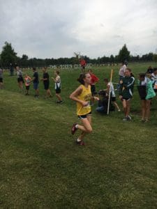 Student finishing a cross country race