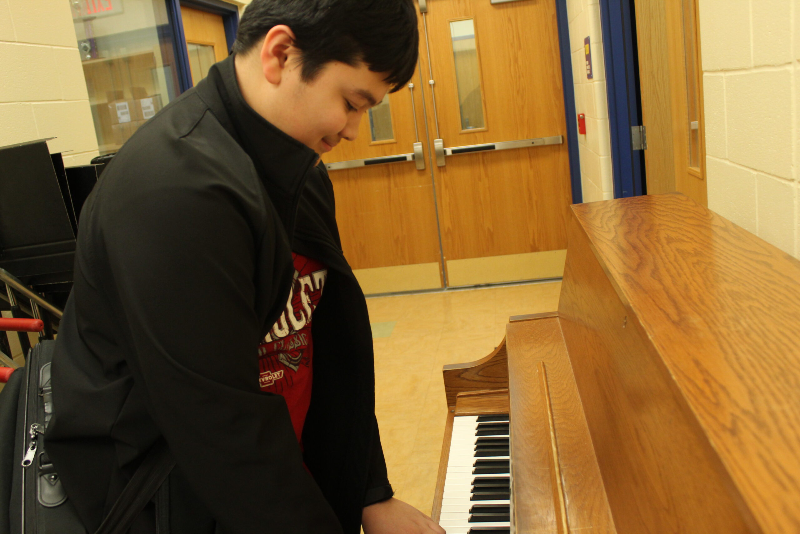 Student playing piano.