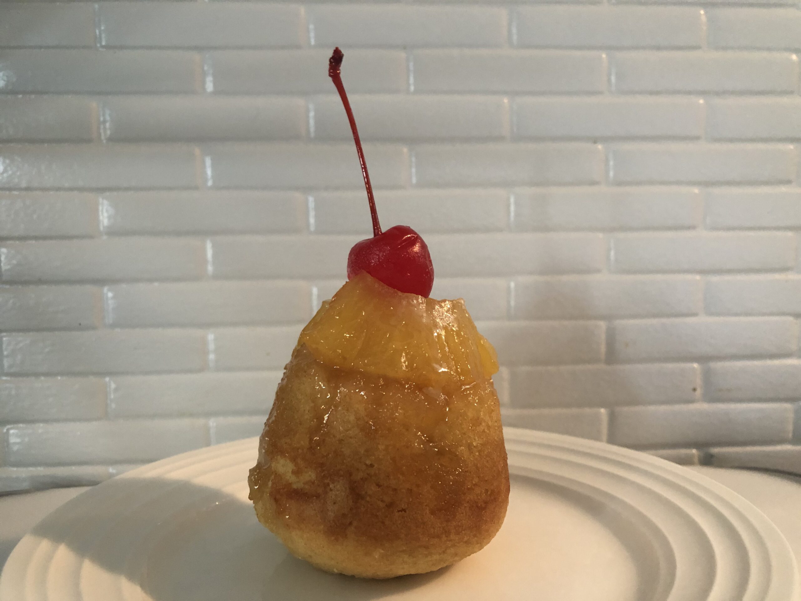 mini pineapple upside-down cake on a plate 